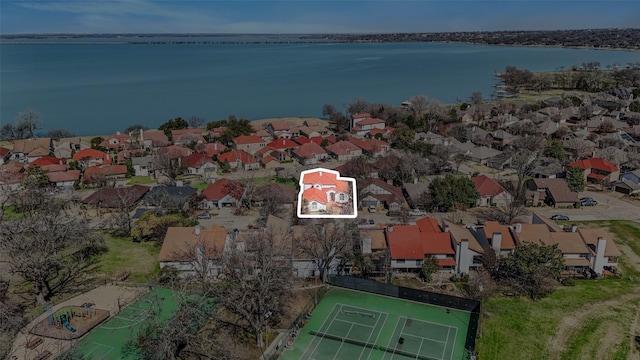 birds eye view of property with a residential view and a water view