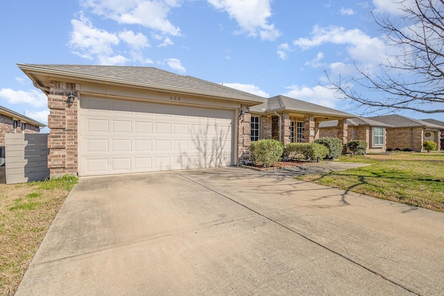 single story home with driveway, roof with shingles, a front lawn, a garage, and brick siding