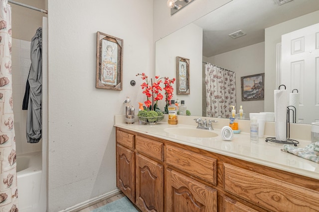 bathroom with visible vents and vanity