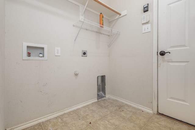 laundry area featuring laundry area, hookup for a washing machine, electric dryer hookup, and baseboards