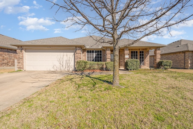 ranch-style house featuring brick siding, a front yard, roof with shingles, a garage, and driveway