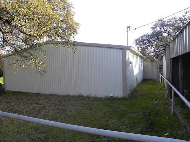 view of side of home with an outdoor structure