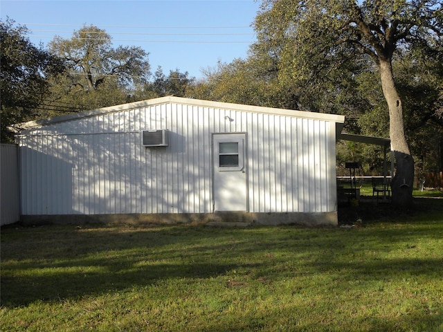 view of outdoor structure with a wall mounted air conditioner