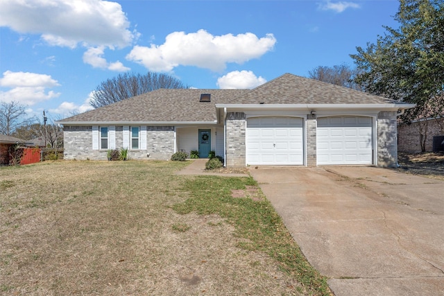 ranch-style house with a front yard, roof with shingles, an attached garage, concrete driveway, and brick siding