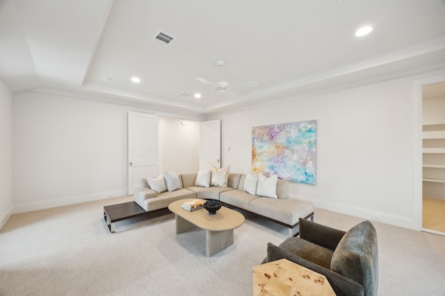 living area featuring carpet flooring, recessed lighting, a raised ceiling, and baseboards