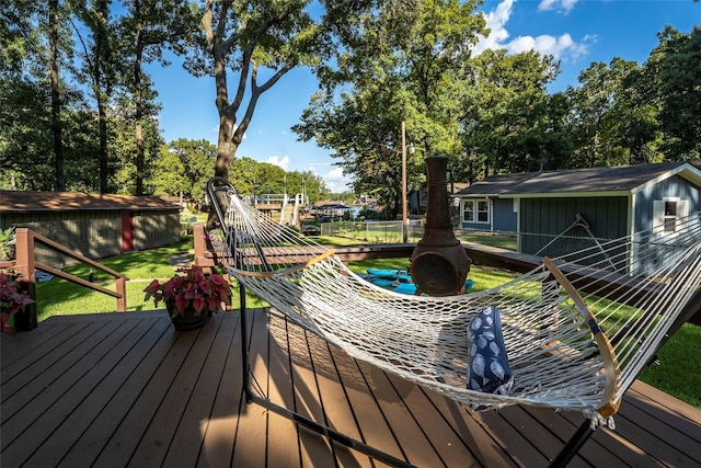 deck with an outbuilding and a yard