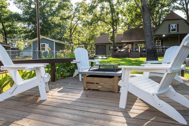 deck with an outdoor structure and a shed