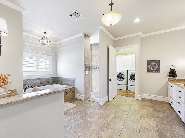 full bathroom featuring visible vents, washing machine and clothes dryer, ornamental molding, a walk in shower, and a bath