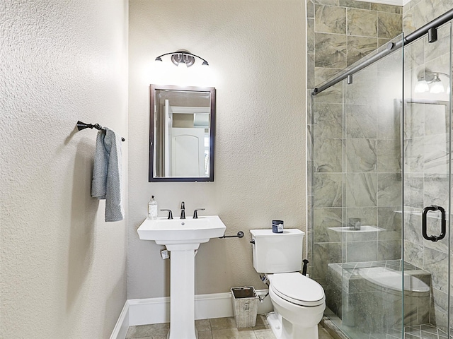 full bathroom with baseboards, toilet, a shower stall, and tile patterned flooring