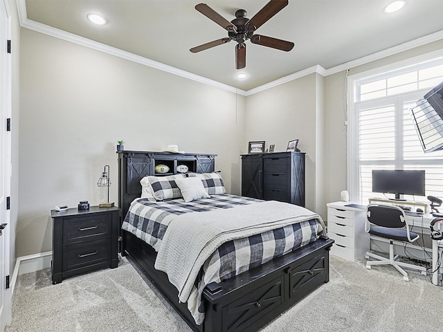 bedroom with ceiling fan, light colored carpet, and ornamental molding