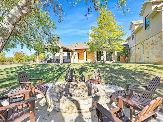 view of patio featuring a fire pit