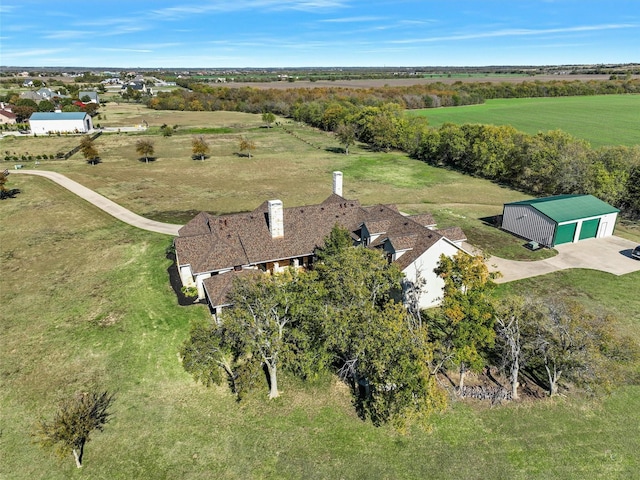 birds eye view of property with a rural view