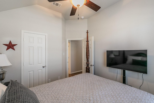 bedroom with lofted ceiling, visible vents, and ceiling fan