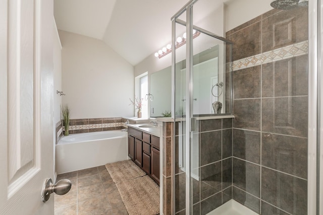 full bathroom featuring vanity, lofted ceiling, tile patterned flooring, a shower stall, and a garden tub