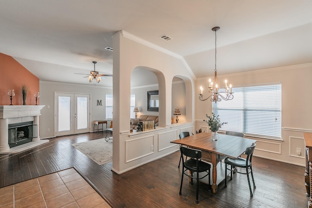 dining room featuring dark wood finished floors, visible vents, and a healthy amount of sunlight