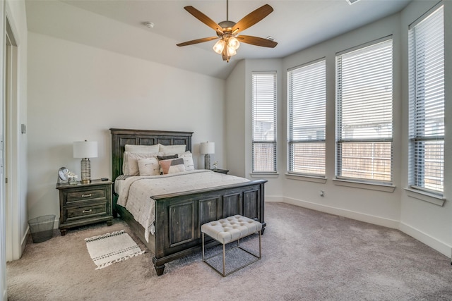 carpeted bedroom featuring baseboards and ceiling fan