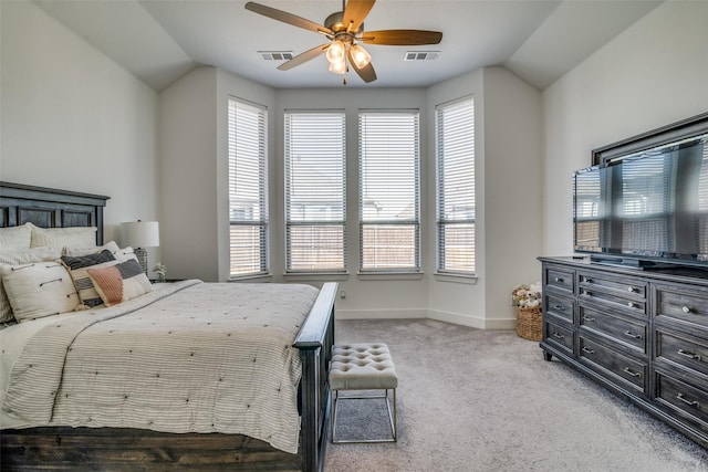 bedroom featuring visible vents, multiple windows, and vaulted ceiling