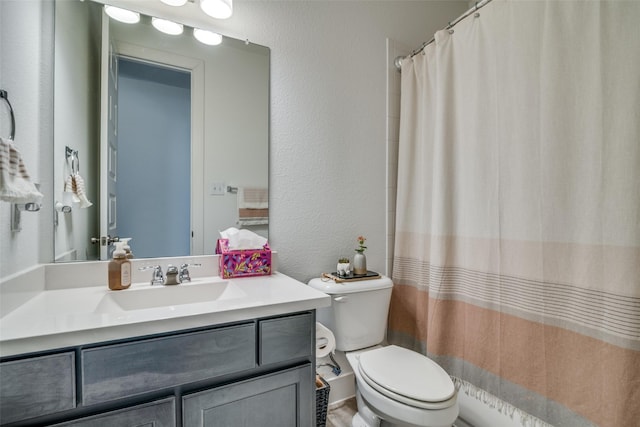 1913 Recioto Dr, Mclendon Chisholm, TX 75032 - bathroom with toilet, a textured wall, vanity, and a shower with shower curtain