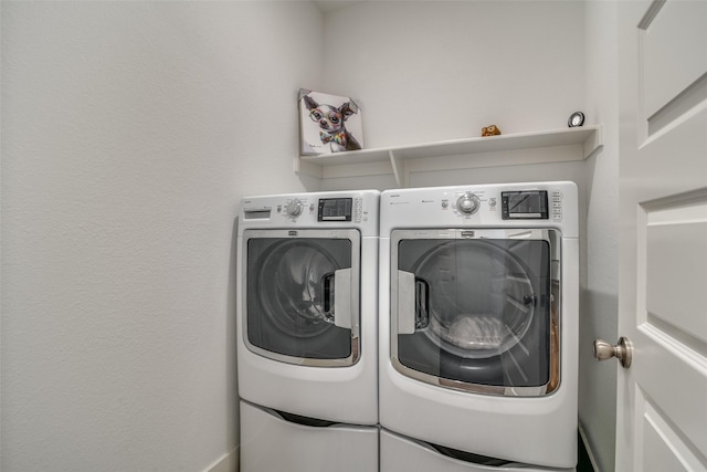 washroom featuring laundry area and independent washer and dryer