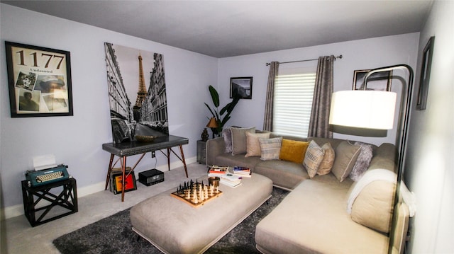 carpeted living room featuring baseboards