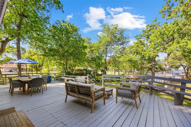 deck featuring an outdoor living space and outdoor dining area