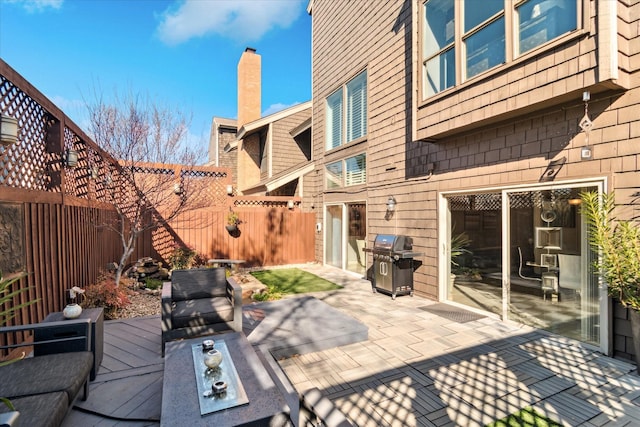 view of patio featuring a grill and a fenced backyard