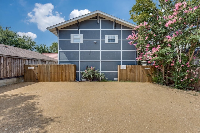 view of property exterior with fence