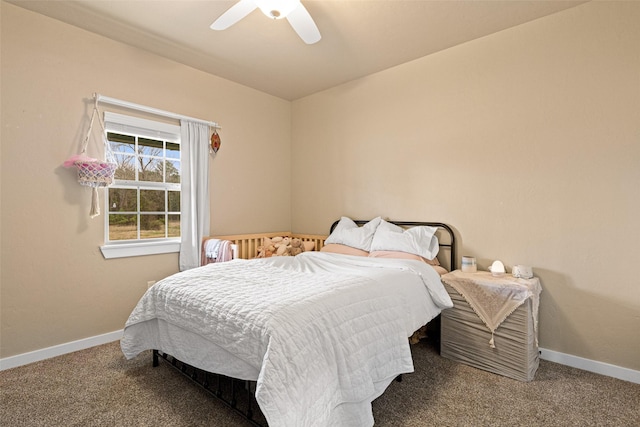 carpeted bedroom with baseboards and a ceiling fan