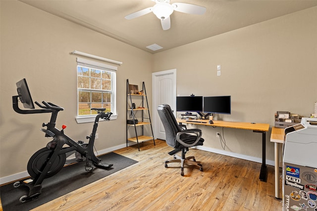 office space with visible vents, ceiling fan, baseboards, and hardwood / wood-style flooring