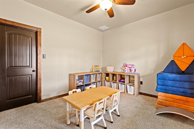 playroom featuring a ceiling fan, visible vents, baseboards, and carpet floors