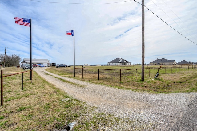 view of street featuring a rural view and driveway