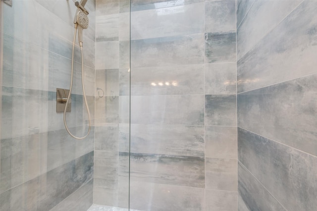 bathroom with tiled shower