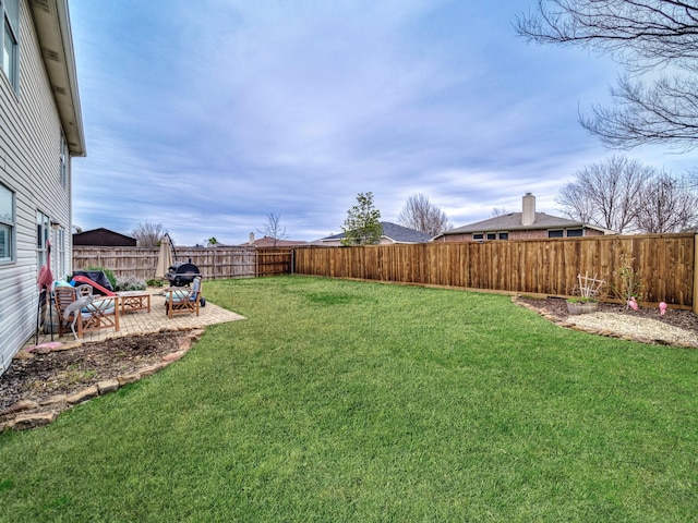 view of yard featuring a fenced backyard and a patio