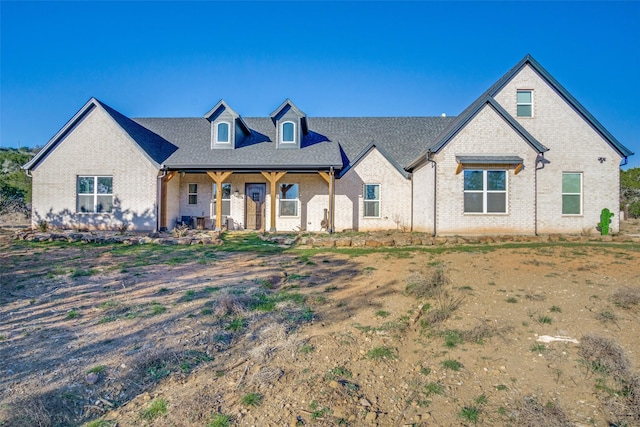 view of front of house with brick siding