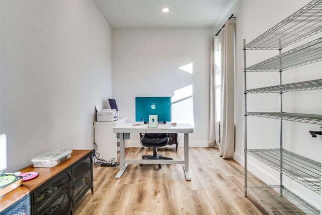 office featuring baseboards and wood finished floors