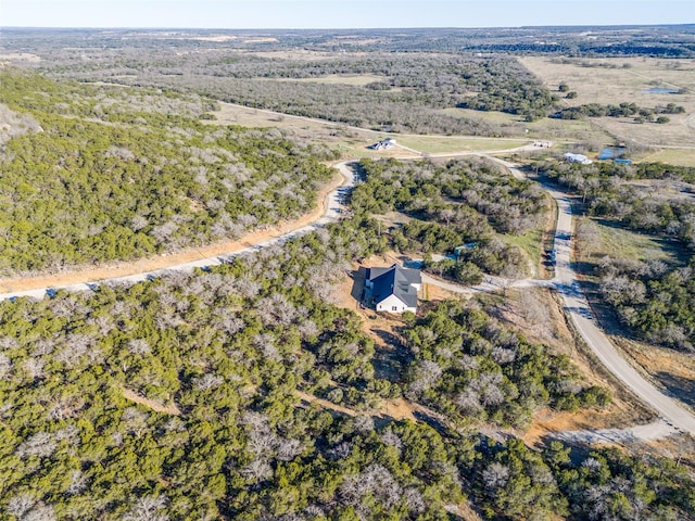 birds eye view of property with a rural view