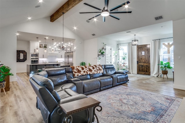 living room with visible vents, high vaulted ceiling, beam ceiling, light wood-type flooring, and a chandelier