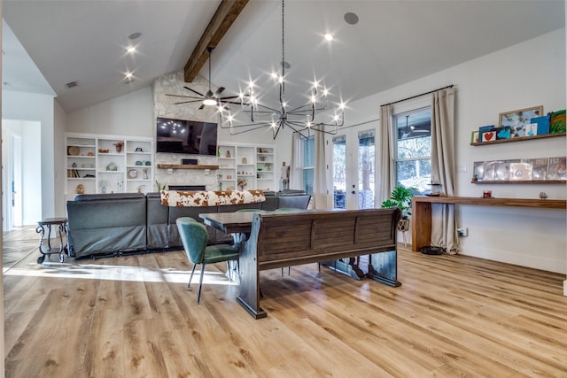 living room with light wood-style flooring, vaulted ceiling with beams, visible vents, and a large fireplace