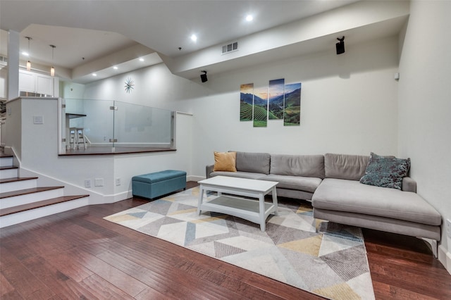 living room with visible vents, recessed lighting, stairs, and wood-type flooring