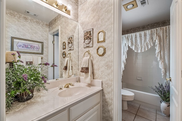 full bathroom with vanity, tile patterned floors, toilet, and visible vents