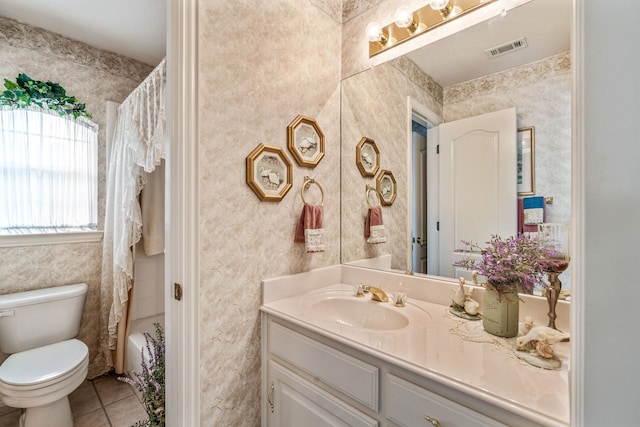 bathroom with tile patterned flooring, visible vents, toilet, and vanity