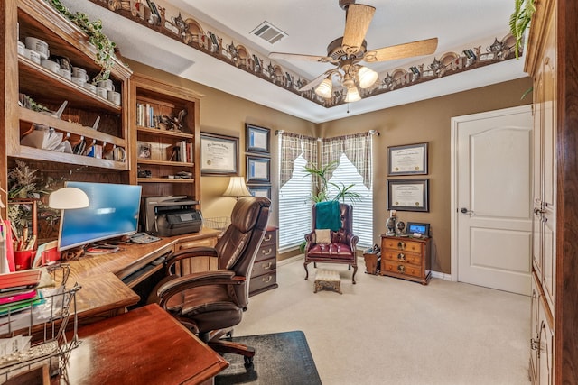 home office with baseboards, visible vents, carpet floors, and ceiling fan