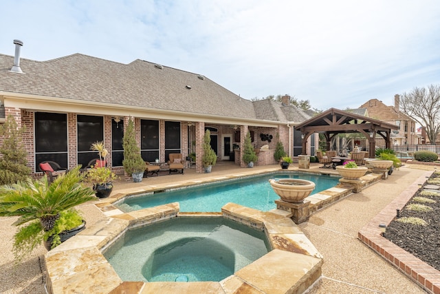 view of swimming pool featuring a gazebo, a patio, and a pool with connected hot tub