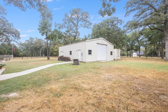 view of yard featuring an outbuilding and fence