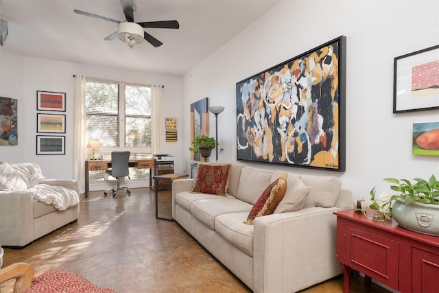 living area with concrete floors and ceiling fan