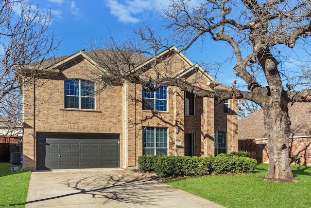 view of front facade with brick siding, a front lawn, and driveway