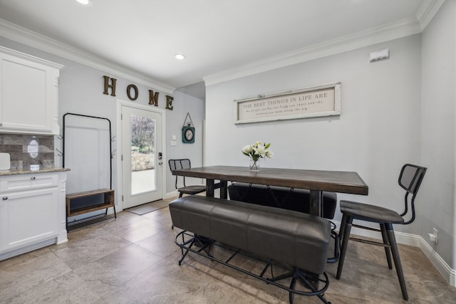 dining room featuring recessed lighting, baseboards, and ornamental molding