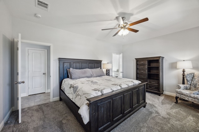 bedroom featuring ceiling fan, light colored carpet, visible vents, and baseboards