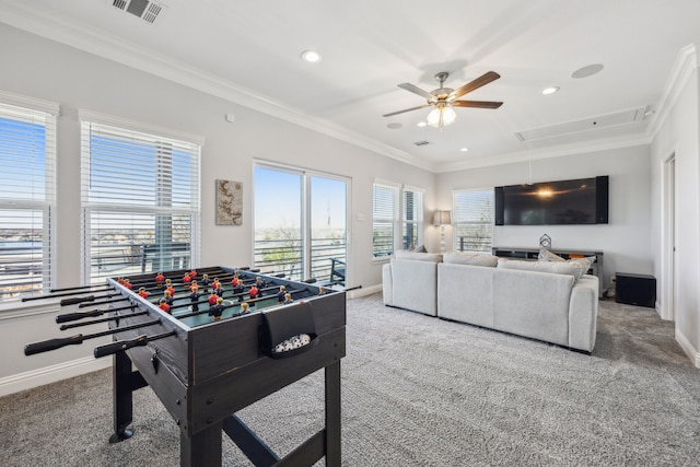 playroom with visible vents, attic access, carpet floors, and ornamental molding