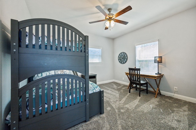 carpeted bedroom featuring baseboards and a ceiling fan